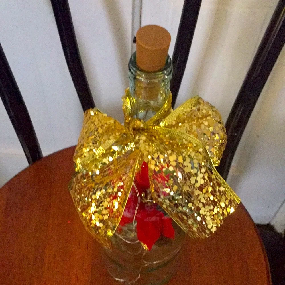 Red poinsettia wine bottle lantern